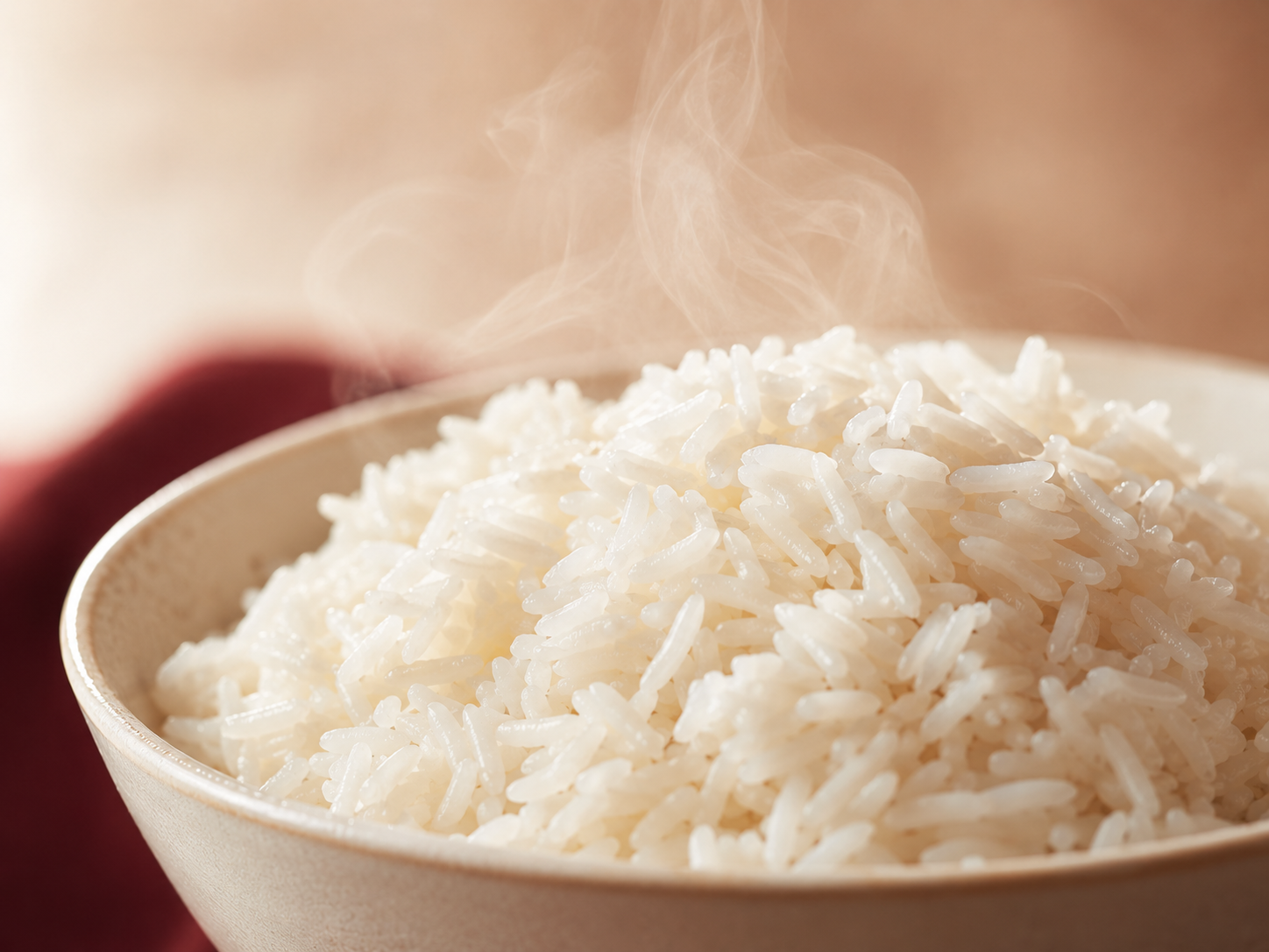 Close-up of hot cooked jasmine rice with visible steam